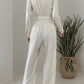 Striped Notched Long Sleeve Tie Waist Jumpsuit